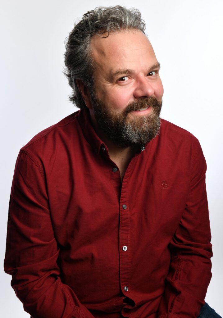 Hal Cruttenden in a red shirt