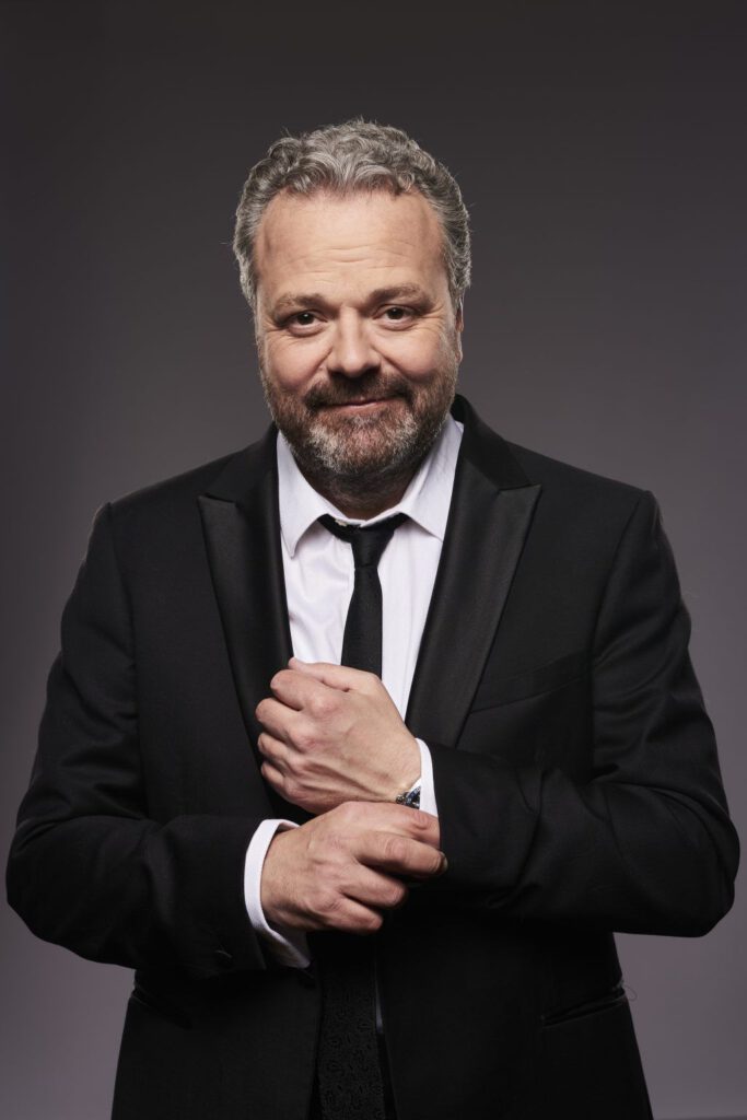 Hal Cruttenden in a Suit